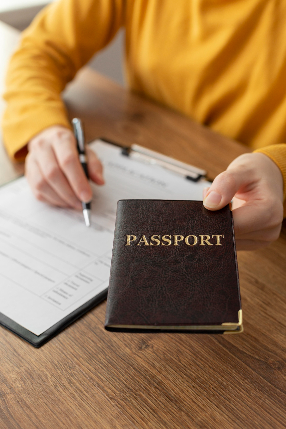 a person handing a passport
